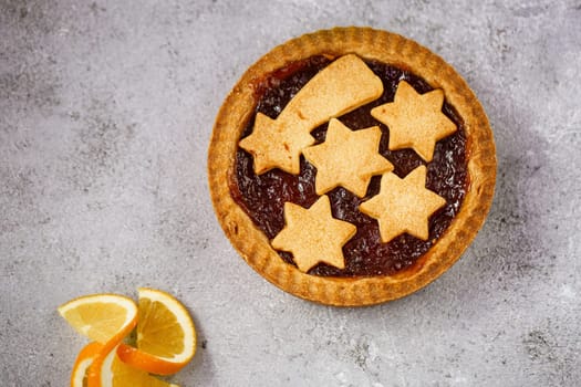 Cranberry jam tart. Top view, vintage tone. A sweet and fragrant rediscover the Christmas traditions. Copy space.