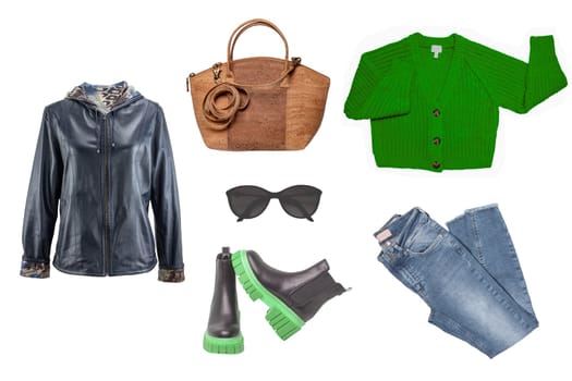 Collage woman clothing. Set of a stylish and trendy leather jacket, boots, jeans, shirt and cardigan, handbag and other accessories isolated on a white background. Latest fashion trends.