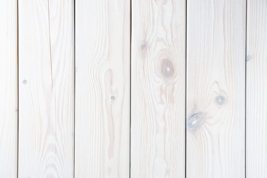 White striped planking. Wooden plank wall background for design and decoration. Empty space. Place for text. Light hardwood material. Vertical row of floorboards. Wooden textured, natural tree.
