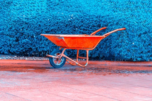 Cement cart red on blue green background