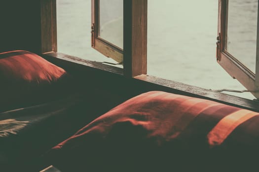Window box with red pillow and natural