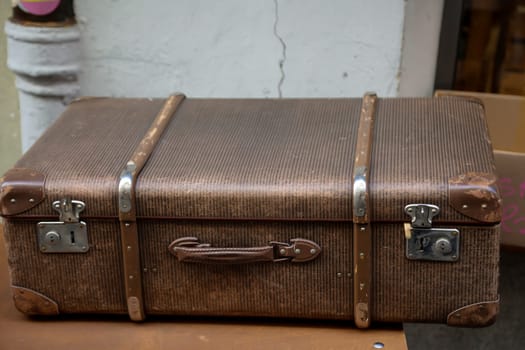 Details of an old suitcase as it was used 50 years ago.