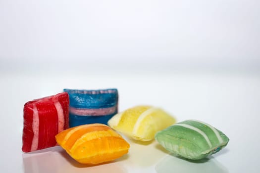 Candy in pillow shape on white background. Delicious sweet tooth.