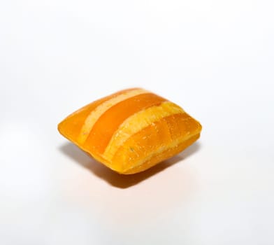 Candy in pillow shape on white background. Delicious sweet tooth.
