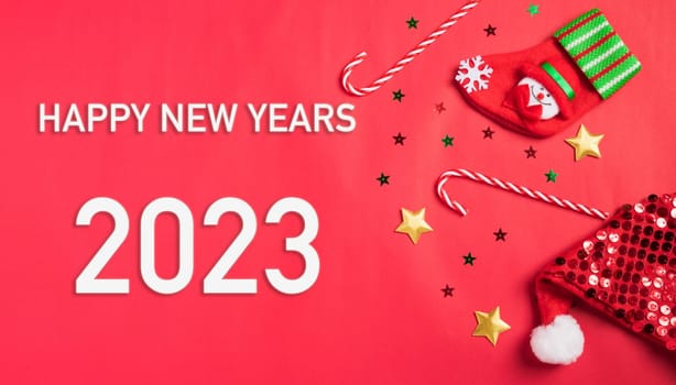 Happy New Year 2023 background. Banner Christmas gifts and decorations with 2023 years number on red background, Flat lay, top view, copy space