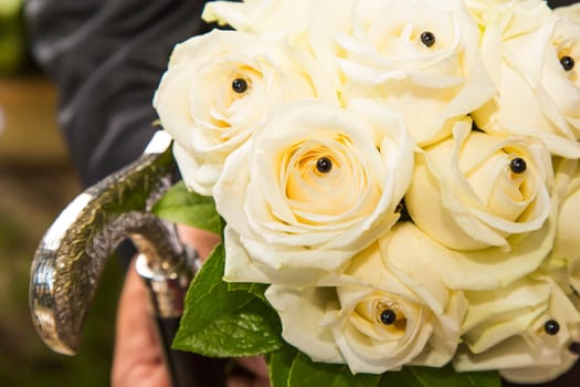 Close-up view of a bridal bouquet made of roses pale yellow