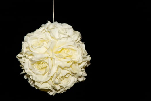 View of a bouquet of white roses on a black background