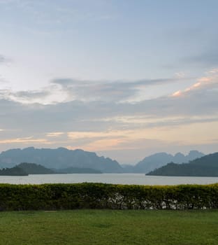 Stunning twilight view of Limestone mountains and lake in Khao Sok National Park, Surat Thani Province, Thailand