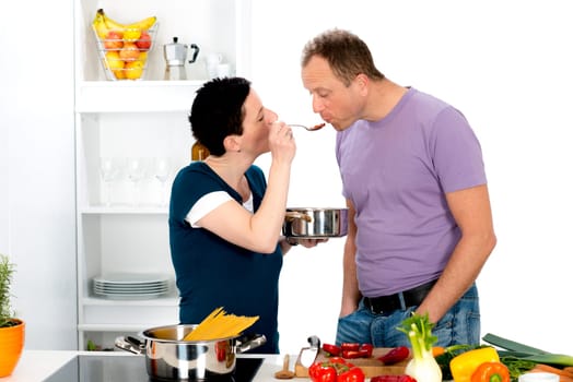 young man test the good food of his wife