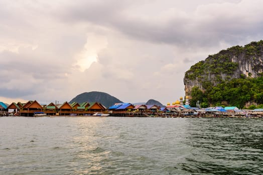 Beautiful landscape of sea at Punyi Island or Koh Panyee floating village in the evening during a boat tour at the Ao Phang Nga Bay National Park, Thailand