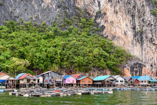 Landscape Koh Panyee or Punyi island home is floating over the sea during a boat tour at the Ao Phang Nga Bay National Park, Thailand