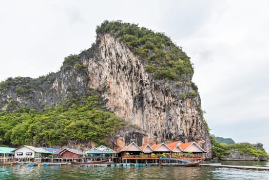 Landscape Koh Panyee or Punyi island home is floating over the sea during a boat tour at the Ao Phang Nga Bay National Park, Thailand