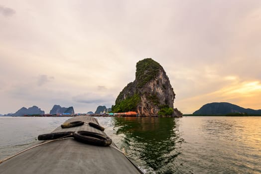 Beautiful landscapes of the sea in the sunset. During the trip from Koh Panyi or Koh Panyee island by boat in Ao Phang Nga Bay National Park, Thailand