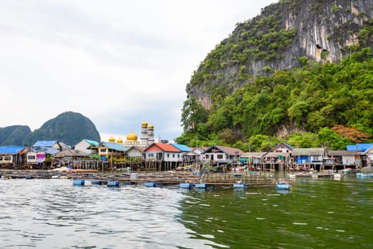 Landscape Koh Panyee or Punyi island home is floating over the sea during a boat tour at the Ao Phang Nga Bay National Park, Thailand
