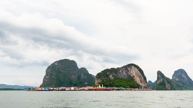 Beautiful landscape sea at Punyi Island or Koh Panyee is fisherman village cultural attractions in during a boat tour at the Ao Phang Nga Bay National Park, Thailand, 16