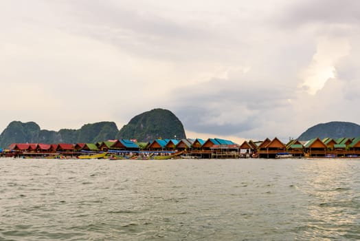 Beautiful landscape of sea at Punyi Island or Koh Panyee floating village in the evening during a boat tour at the Ao Phang Nga Bay National Park, Thailand