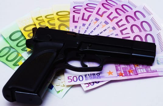 Pistol and money