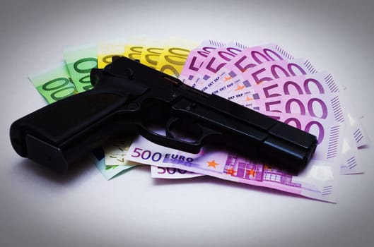 Pistol and money