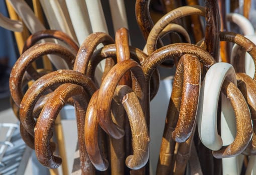 Walking sticks displayed at traditional market stall. Selective focus