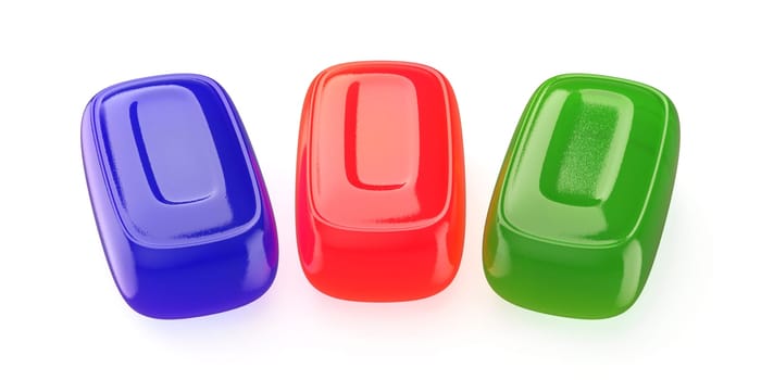 Blue, red and green colored hard candies on white background