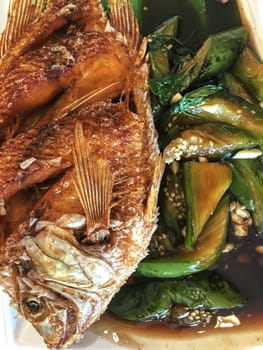 Fried fish with grilled eggplant