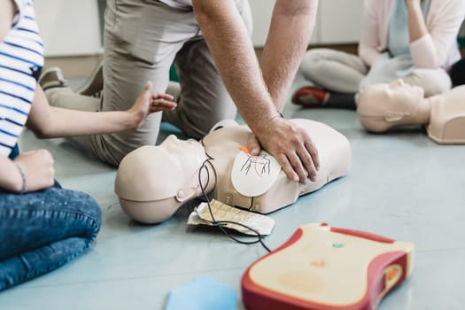 First aid cardiopulmonary resuscitation course using automated external defibrillator device, AED.