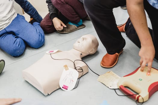 First aid cardiopulmonary resuscitation course using automated external defibrillator device, AED.