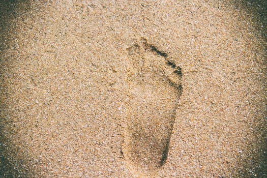 Footprints on the beach seashore for copy space