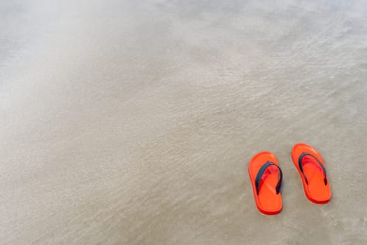 Red shoes on the beach on daylight