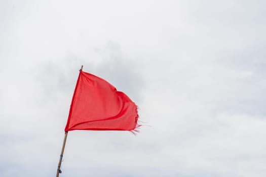 Red flag warning flags wind blue sky