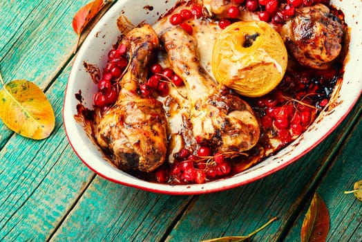 Chicken meat in apple and berry marinade. Roasted chicken thighs. Copy space, recipe place