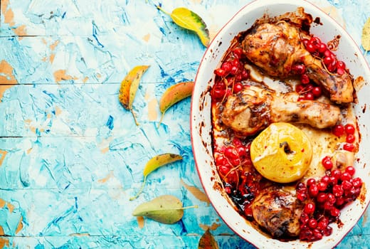 Chicken meat in apple and berry marinade. Roasted chicken thighs. Copy space, recipe place