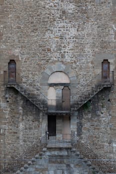 Exterior of antique building with Escher architecture style. Simmetry and geometric perspective.