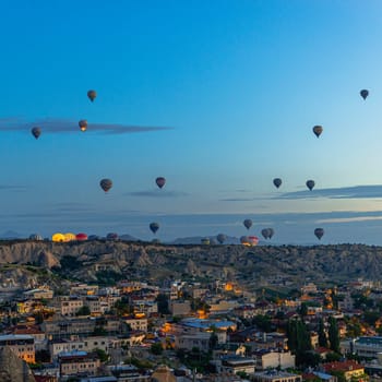GOREME/TURKEY - June 29, 2022:  hot air balloons fly at sunrise