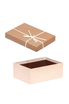 Decoration element isolated. Close-up of a brown white present or gift box with white ribbon bow isolated on a white background. Birthday, valentine, wedding or other holidays. Macro.