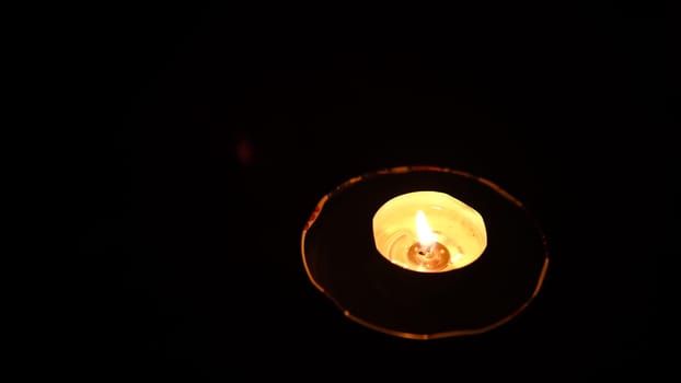 Candle burning, Detail of candle flames alight, lights from candles burning up close, flame burn candle lighting. Hand burn candle by the match vesta.