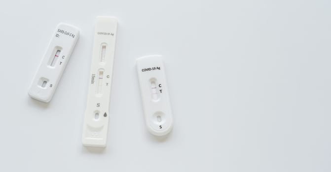 Coronavirus Covid-19 antigen test with various result on white background.