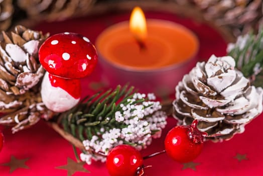 advent wreath with burning candle