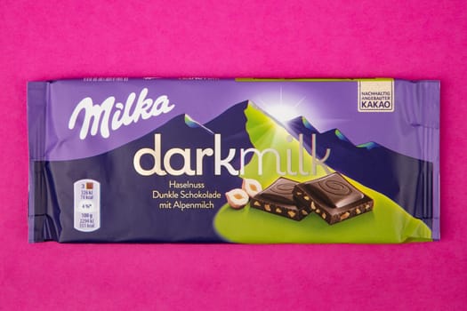WETZLAR GERMANY - 2022-04-11: Milka chocolate bar on purple background. Milka milk chocolate bar. Milka is a brand of chocolate confection which originated in Switzerland in 1901.