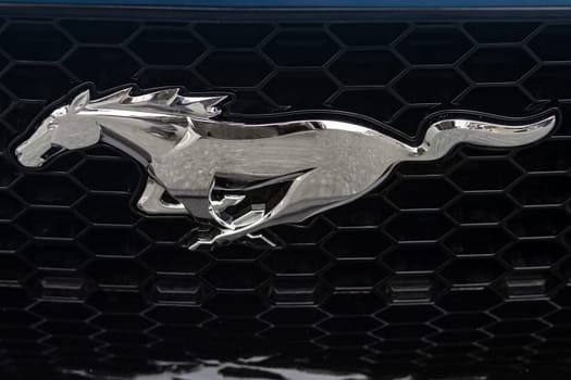 WETZLAR, GERMANY 2022-04-23: Ford logo on front of a car. Ford is an American multinational automaker that has its main headquarters in Detroit.