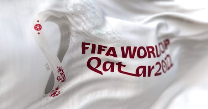 Doha, QA, October 2022: Detail of the FIFA Qatar 2022 World Cup white flag waving in the wind. The World Cup will take place in Qatar from 20 November to 18 December 2022