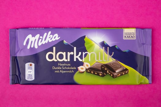 WETZLAR GERMANY - 2022-04-11: Milka chocolate bar on purple background. Milka milk chocolate bar. Milka is a brand of chocolate confection which originated in Switzerland in 1901.