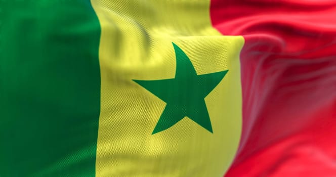 Detail of the Senegal national flag waving in the wind. The Republic of Senegal is a country in West Africa. Fabric textured background. Selective focus. 3D illustration