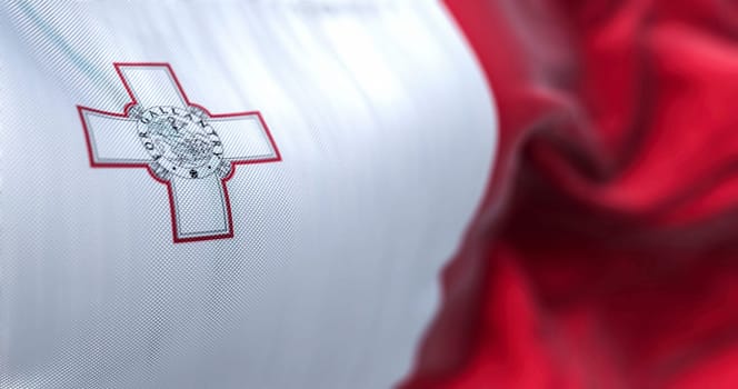 Close-up view of the Maltese national flag waving in the wind. The Republic of Malta is an island country in the Mediterranean Sea. Fabric textured background. Selective focus. 3d illustration