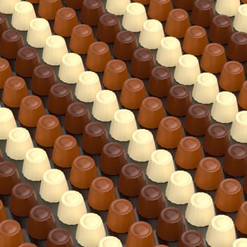 Many rows with dark, white and milk chocolate pralines
