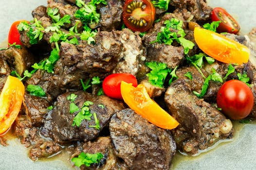 Chicken liver fried with mushrooms and tomatoes. Tasty liver in Georgian