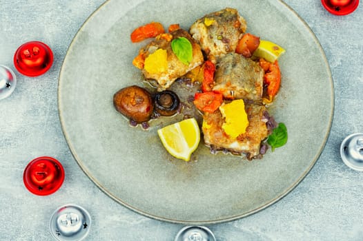 White fish hake cooked with mushrooms in the oven dish