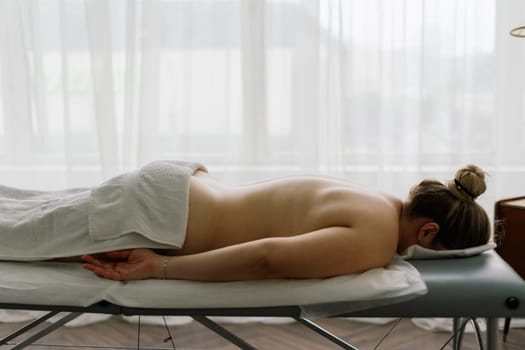 Anti-cellulite foot massage for fat woman. Concept of personal care, weight loss, diet. Close-up.