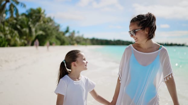 Woman With Child Daughter Together On Beach. Summer Vacation