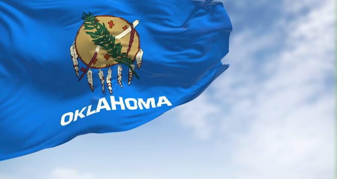 Close up view of the Oklahoma state flag waving. Oklahoma is a state in the South Central region of the United States. Fabric textured background. Selective focus. 3D illustration